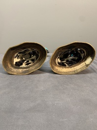 A pair of turquoise- and aubergine-glazed parrots with gilt bronze mounts, Kangxi