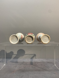 A Chinese famille rose tea caddy, two covered milk jugs and three vases, Yongzheng/Qianlong