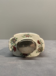 A Chinese famille rose tea caddy, two covered milk jugs and three vases, Yongzheng/Qianlong
