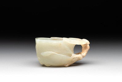 A Chinese jade peach-shaped brush washer on wooden stand, 19th C.