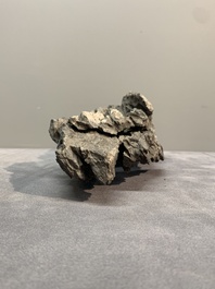 A Chinese ying stone scholar's rock on wooden stand, 20th C.