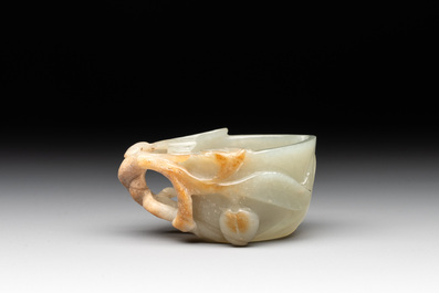 A Chinese jade peach-shaped brush washer on wooden stand, 19th C.