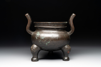 A Chinese bronze tripod censer with two handles, Ming