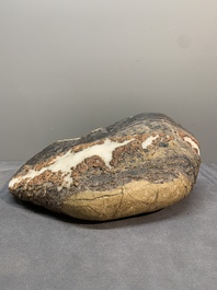 A Chinese wucai Lingbi stone scholar's rock on wooden stand, 20th C.