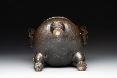 A Chinese bronze tripod censer with two handles, Ming