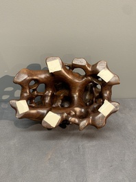 A Chinese ying stone scholar's rock on wooden stand, 20th C.