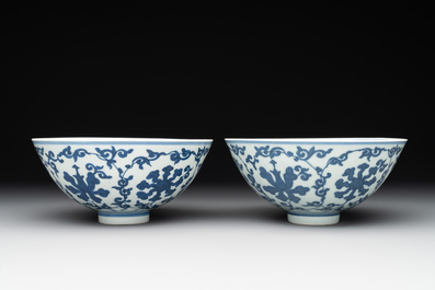 A pair of Chinese blue and white 'lotus scroll' bowls, Yongzheng mark and possibly of the period