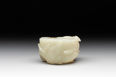 A Chinese jade peach-shaped brush washer on wooden stand, 19th C.