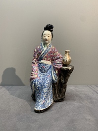 A Chinese famille rose lady and a Buddha, 19/20th C.