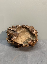 A Chinese ying stone scholar's rock on wooden stand, 20th C.