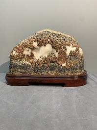 A Chinese wucai Lingbi stone scholar's rock on wooden stand, 20th C.