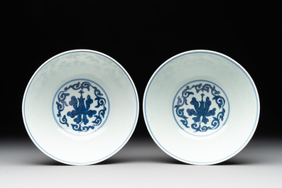 A pair of Chinese blue and white 'lotus scroll' bowls, Yongzheng mark and possibly of the period
