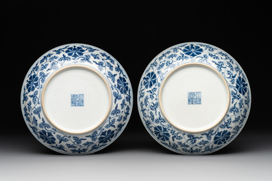 A pair of imperial Chinese blue and white 'lotus scroll' plates, Qianlong mark and of the period