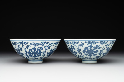 A pair of Chinese blue and white 'lotus scroll' bowls, Yongzheng mark and possibly of the period