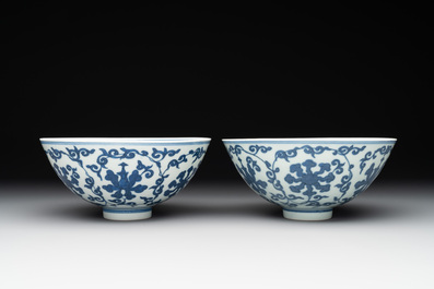A pair of Chinese blue and white 'lotus scroll' bowls, Yongzheng mark and possibly of the period