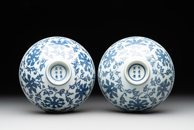 A pair of Chinese blue and white 'lotus scroll' bowls, Yongzheng mark and possibly of the period
