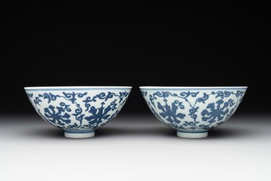 A pair of Chinese blue and white 'lotus scroll' bowls, Yongzheng mark and possibly of the period