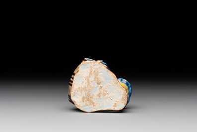 A polychrome Dutch Delft model of a boy rolling a 'wijn azijn' barrel, 18th C.