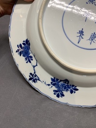 A Chinese blue and white dish with floral design, Kangxi mark and of the period