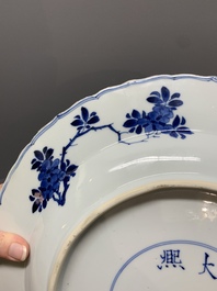 A Chinese blue and white dish with floral design, Kangxi mark and of the period