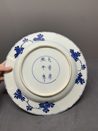 A Chinese blue and white dish with floral design, Kangxi mark and of the period