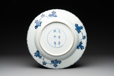 A Chinese blue and white dish with floral design, Kangxi mark and of the period