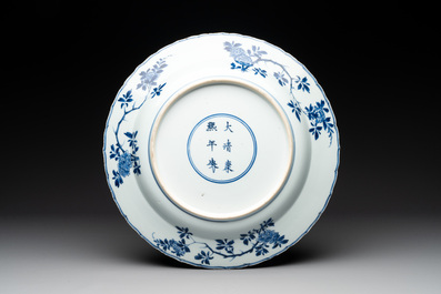 A Chinese blue and white 'four seasons' dish, Kangxi mark and of the period