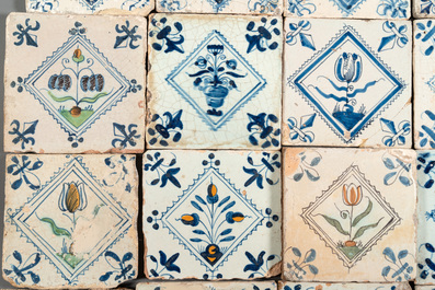 40 Dutch Delft blue, white and polychrome 'diamond' tiles with flowers, 17/18th C.