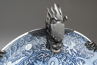 A massive Chinese blue and white reverse-decorated  'dragon' charger with bronze mounts, Chuxiu Gong Zhi mark, Guangxu