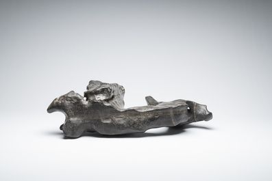 A large Chinese Lingbi stone scholar's rock on wooden stand, 19/20th C.
