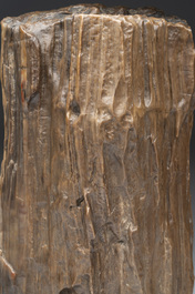 A Chinese petrified wood scholar's rock on wooden stand, 17/18th C.