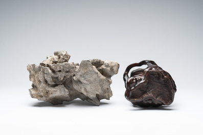 A Chinese Taihu stone scholar's rock on wooden stand, 20th C.