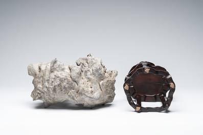 A Chinese Taihu stone scholar's rock on wooden stand, 20th C.