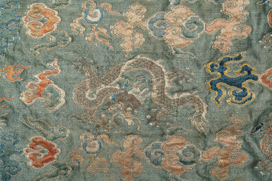 A Chinese green-ground embroidered silk panel with dragons among clouds, 18th C.