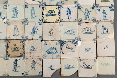 105 polychrome, blue and white Dutch Delft tiles with figures, flowers and animals, 17/18th C.