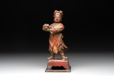 A Chinese gilt-lacquered bronze offering figure on stand, Ming