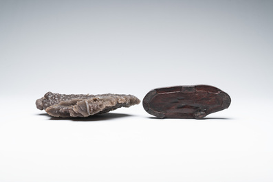 A Chinese grape agate scholar's rock on wooden stand, 20th C.