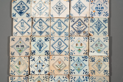 40 Dutch Delft blue, white and polychrome 'diamond' tiles with flowers, 17/18th C.