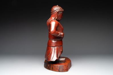 A Japanese lacquered wooden figure of a guardian, 19th C.