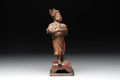 A Chinese gilt-lacquered bronze offering figure on stand, Ming