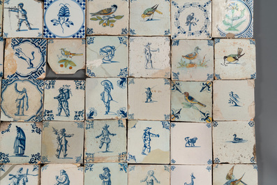 105 polychrome, blue and white Dutch Delft tiles with figures, flowers and animals, 17/18th C.