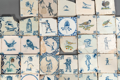 105 polychrome, blue and white Dutch Delft tiles with figures, flowers and animals, 17/18th C.