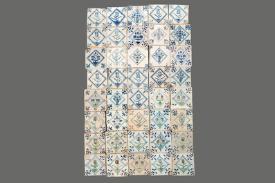 40 Dutch Delft blue, white and polychrome 'diamond' tiles with flowers, 17/18th C.