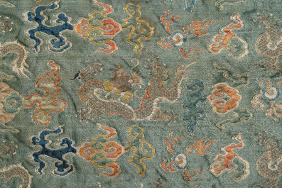 A Chinese green-ground embroidered silk panel with dragons among clouds, 18th C.