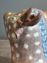 A pair of Chinese blue, white and copper-red stag-shaped jardini&egrave;res, 19th C.