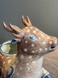 A pair of Chinese blue, white and copper-red stag-shaped jardini&egrave;res, 19th C.