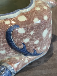 A pair of Chinese blue, white and copper-red stag-shaped jardini&egrave;res, 19th C.