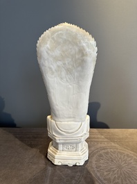 A Chinese Dehua blanc de Chine seated Guanyin, Qianlong mark, Republic