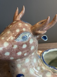 A pair of Chinese blue, white and copper-red stag-shaped jardini&egrave;res, 19th C.