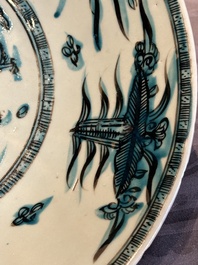 A Chinese Swatow slip-decorated blue-glazed 'chrysanthemum' dish and a turquoise- and black-enamelled 'dragon' dish, Ming